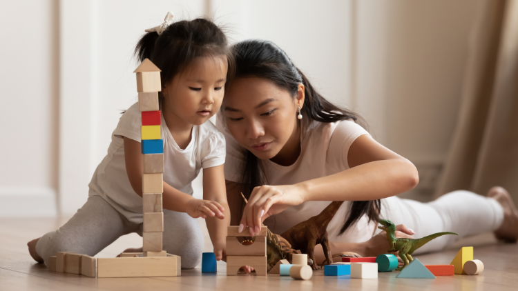 mother-playing-with-toddler-on-the-floor